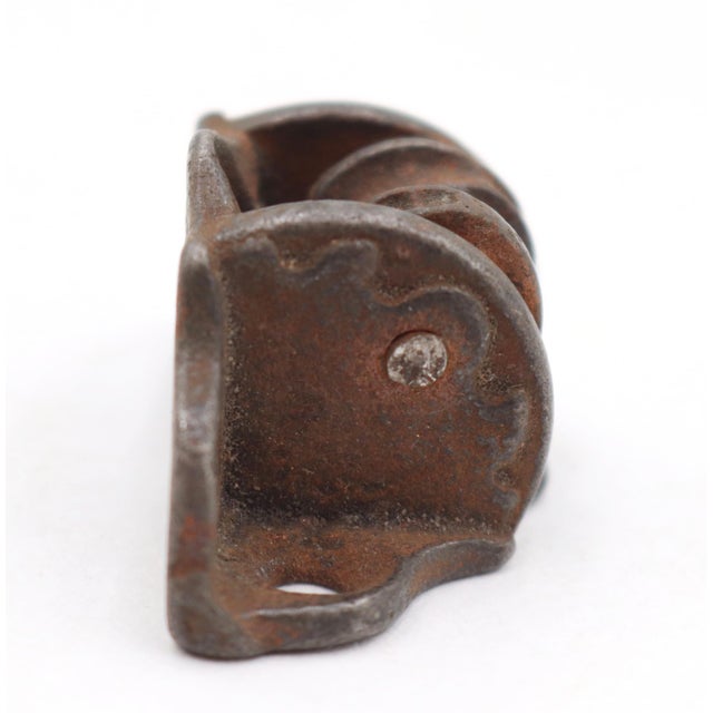 Antique cast iron recessed window sash pulley used for double hung windows. The original mounting screws are not...