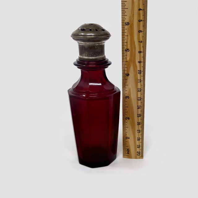 Add a dramatic touch of Victorian elegance to your collection with this striking Antique Ruby Cranberry Glass Sugar...