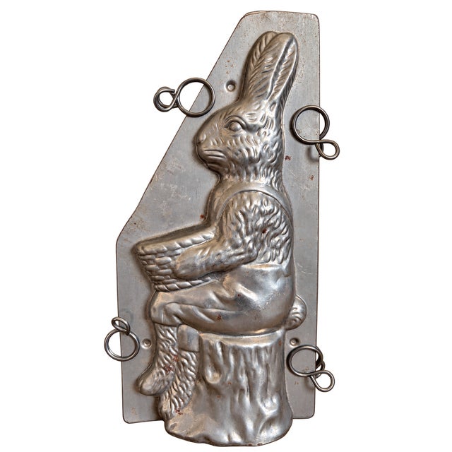 Charming vintage two-piece metal chocolate bunny mold featuring a beautifully detailed Easter rabbit holding a woven...