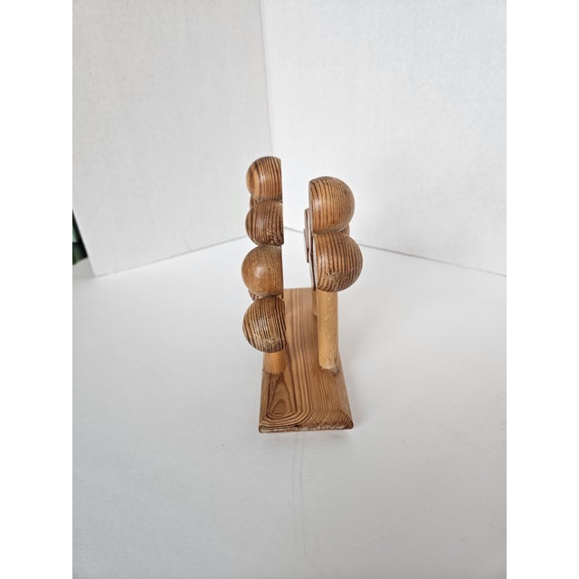 Truly a style like none other! Finnish design is art. Made by "aarikka" Finland, this playful napkin holder is an...