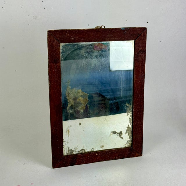 The more distressed the better and add a lovely wiggly scratched lines on the wood frame and you have a most lovely and...