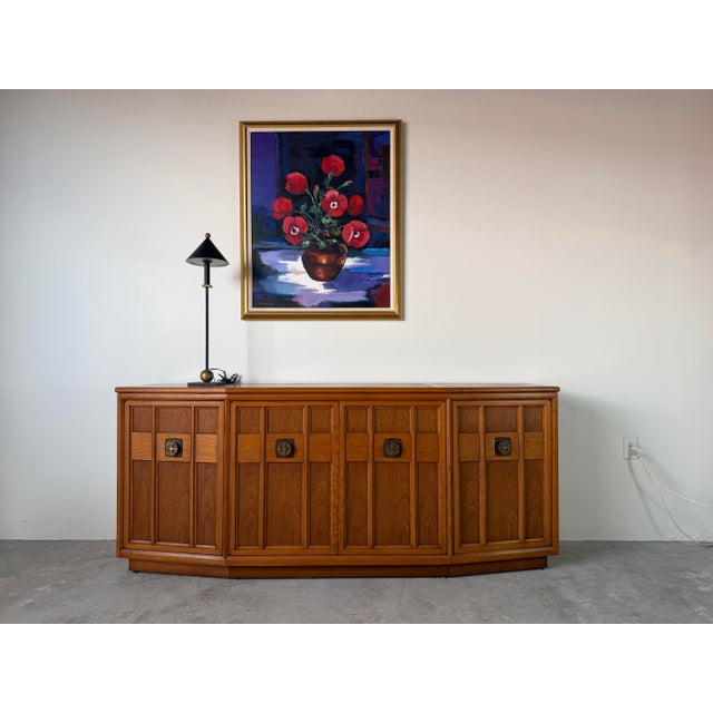 A striking 1970s Heritage Furniture sideboard credenza crafted in beautifully grained walnut, showcasing classic Mid-...
