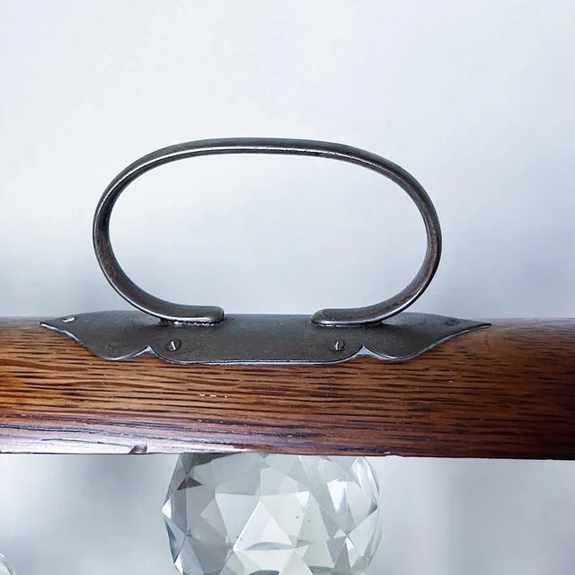 Antique Oak & Brass Tantalus with Set of 3 Whiskey or Liqueur Crystal Decanters Antique tantalus holding three crystal...