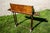 Antique mahogany bookstand or lectern-style side table with a rich reddish-brown patina with visible grain, two pull-out...