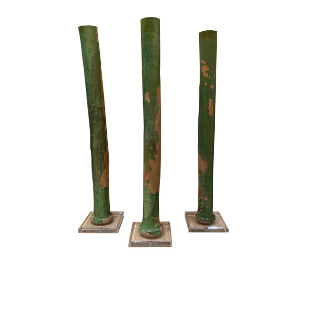 19th century terra cotta “Goutiere”, leave through on acrylic bases from France. Bases are 7.5” Square and the Goutiere...