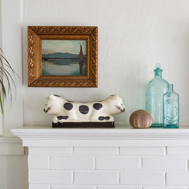 This set of antique apothecary bottles is paired for their matching deep aqua color. A large cylindrical, two-liter bottle...