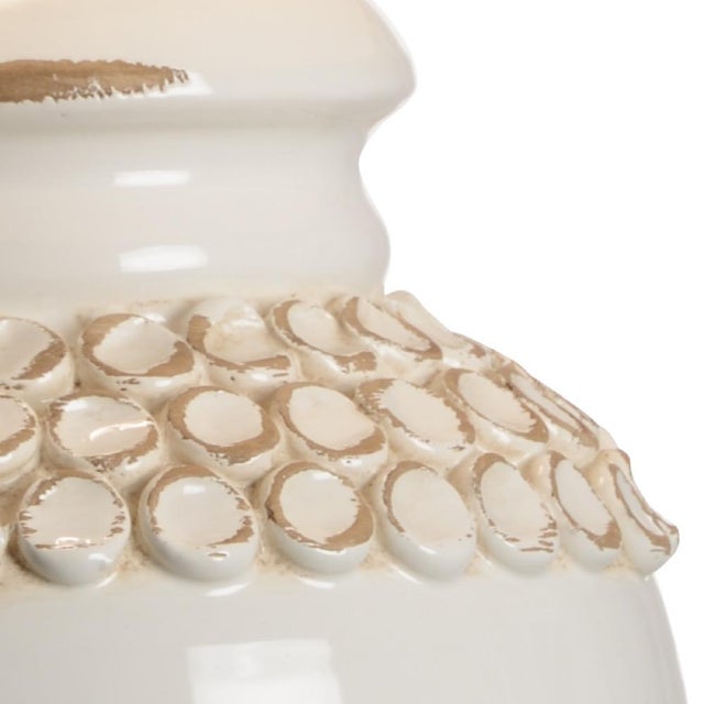 Hand sculpted, aged cream glazed italian ceramic with a bronze mounting. Designed by vietri. 30h x 6w x 6d Shade...