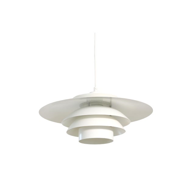 White vintage Danish pendant lamp in the style of Poul Henningsen. This lamp is from Form-light and dates back to the...