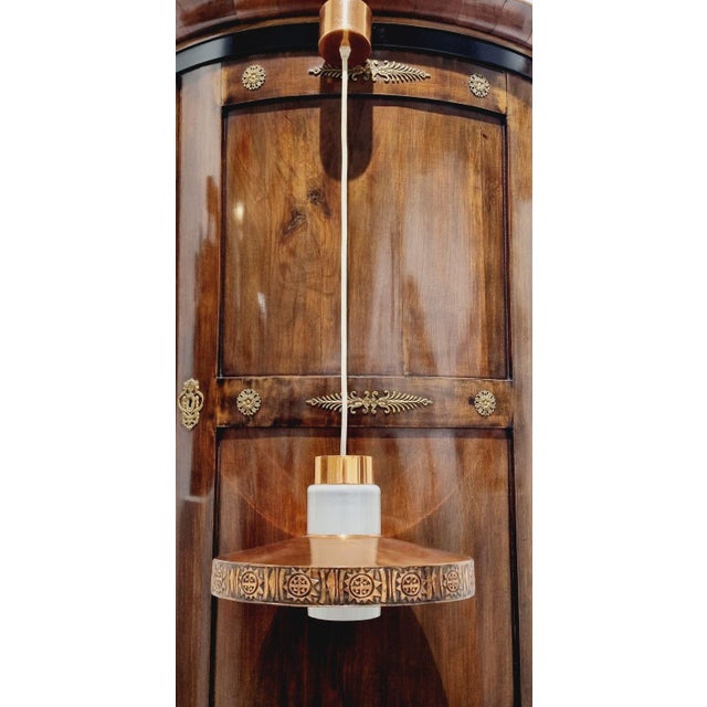 This striking mid-century hanging light is a true statement piece, showcasing the refined vision of noted designer György...