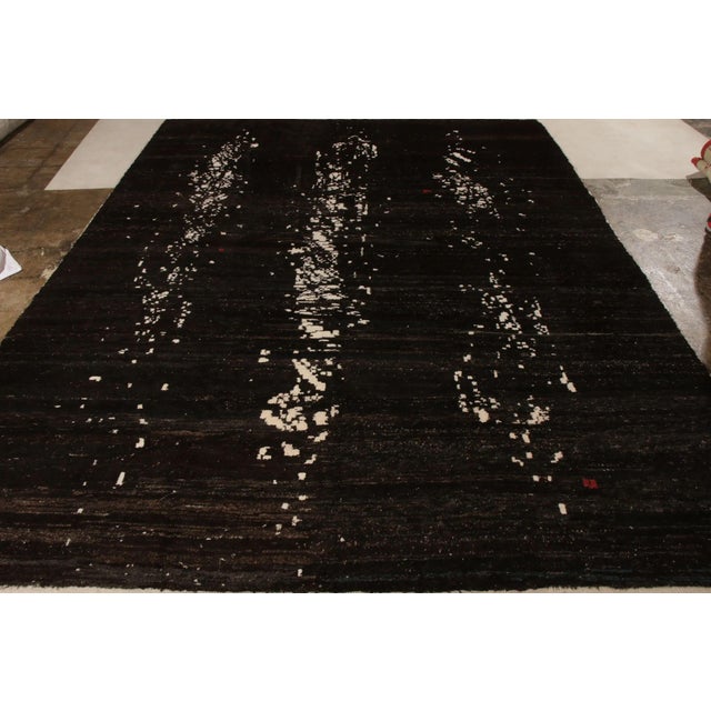 An 8 X 11 hand knotted abstract rug from Rug & Kilim’s New & Modern Collection. Made with fine quality goat hair wool, the...
