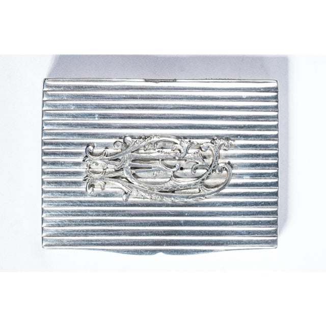 Immerse yourself in the elegance of a bygone era with this captivating 19th-century Continental silver snuff trinket box....
