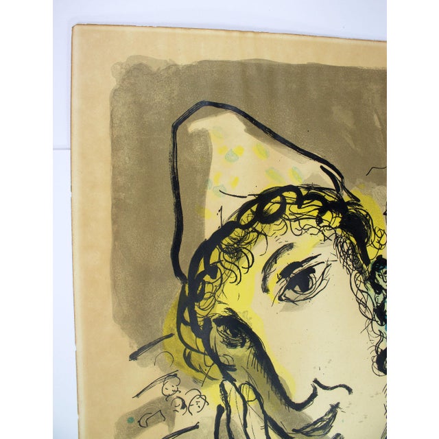 Original Lithograph. Discoloration, foxing, and minor paper loss around the perimeter, but no tears or creases. This...