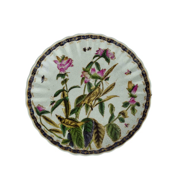This exquisite set of three decorative porcelain plates features a masterful blend of naturalist illustration and...