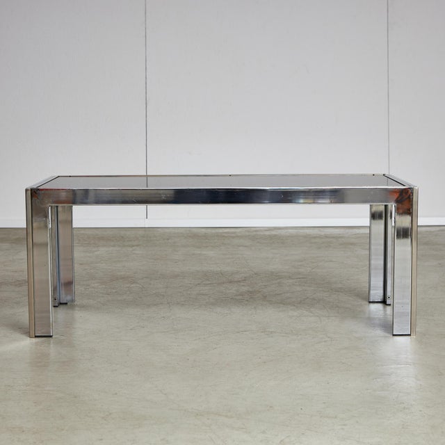 This chrome coffee table has a golden stripe around the smoked glass top and legs, distinguishing it among other coffee...