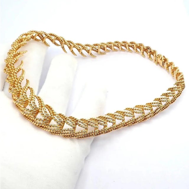 This vintage Tiffany & Co. France necklace attributed to Georges Lenfant, crafted in rich 18k yellow gold with an...