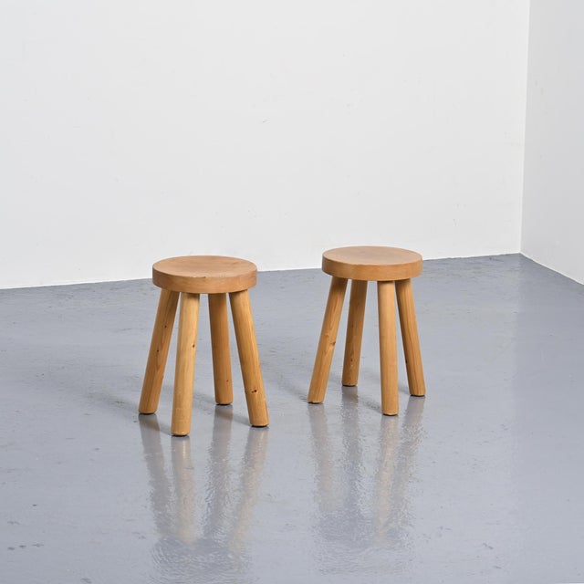 This pair of stools was designed by René Martin in the 1960s. The pine frame consists of four round legs supporting a...