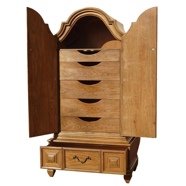 Splendid Thomasville oak armoire in 1960s Spanish Colonial Revival/Hollywood Regency style.