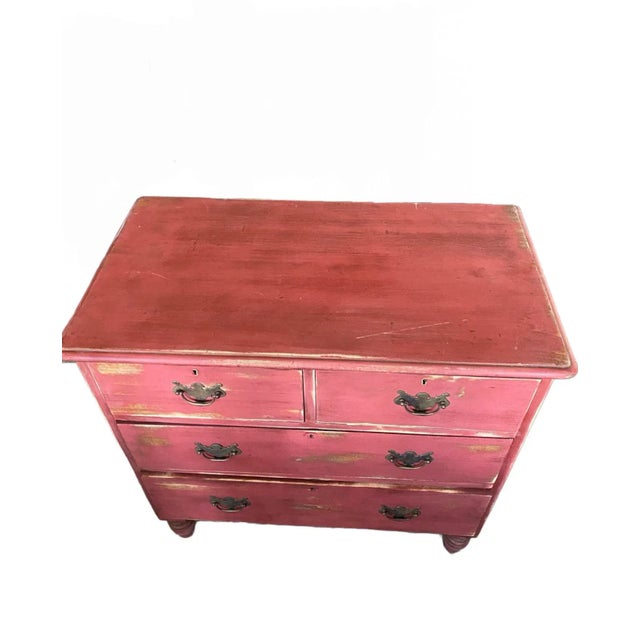 This antique English dresser is a restore piece that has been painted red. This dresser has 2 smaller drawers and 2 longer...