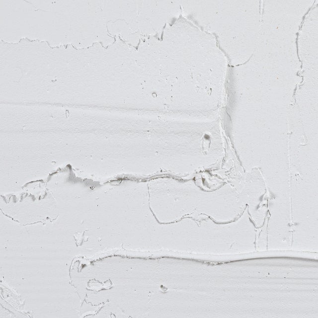 A captivating exploration of depth and dimension, this abstract textural painting by Michael Allen is a striking statement...