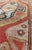 The various shades of red pair elegantly with the bold tones of light blue, yellow and charcoal, laid out over two large...