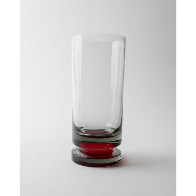 This vintage set of 6 drinking glasses from the 1970s combines elegant proportions with a distinctive retro color palette....
