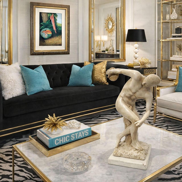 Offering a table sculpture of Discobolus with a dynamic, classical‑style figure of a discus thrower, circa 1950s. The...