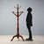 Walnut-stained lime wood coat rack, dating to the late 19th century, from Italy. The structure features six hangers...