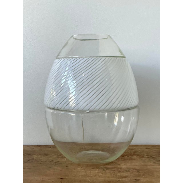 This stunning vintage Italian stacked glass table lamp is a masterful display of mid-century glassmaking artistry. Crafted...