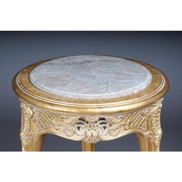 Finely carved gold side table with marble top, Louis XV Excellent French Louis XV style table. High-quality, solid beech...