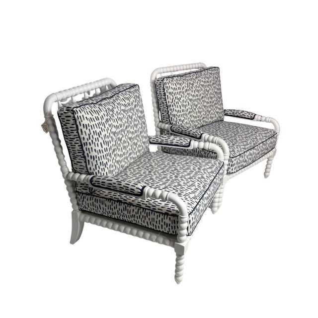 A stylish pair of bobbin armchairs featuring sculptural spool-turned details in a crisp white finish. Upholstered in bold...