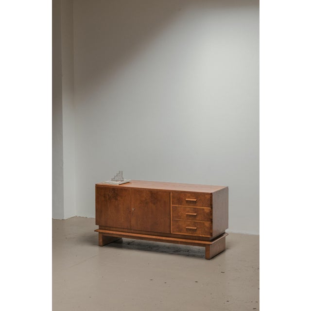 Art deco sideboard produced around 1940 in Denmark. This sideboard is made out of a beautiful, grained veneer which soaks...
