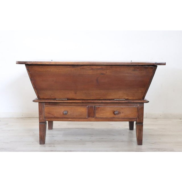 Antique ItalianCupboard dating back to the 19th century at a great price. Crafted from solid walnut, its structure is...
