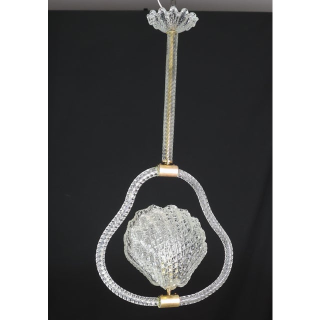 Stunning Murano chandelier by artist Barovier e Toso with murano glass. The pendant consists of 5 glass elements and a...