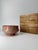 This is a vintage Japanese Aka-Raku (Red Raku) tea bowl, accompanied by its original wooden storage box (kiribako)....