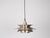 The lamp's form was designed based on the principle of a reflective system that directs light not only downward but also...