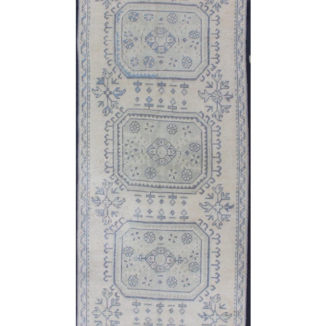 Vintage Turkish Oushak Runner in Faded Blue in Neutral Background For Sale - Image 4 of 13