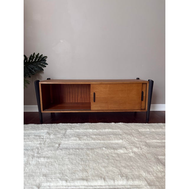 Gorgeous teak media cabinet/console with sliding doors and black accent “exoskeleton” legs and handles. Just refinished...
