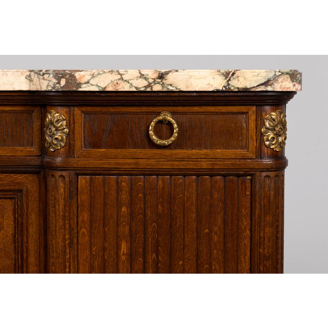 An exceptional late 19th-century French Louis XVI style sideboard by Parisian cabinetmakers Haentgés Frères, sourced in...