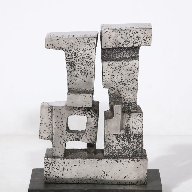 The "Duet" Modernist Geometric Sculpture by Paul Mount (1922-2009) is made in Polished and textured stainless steel....