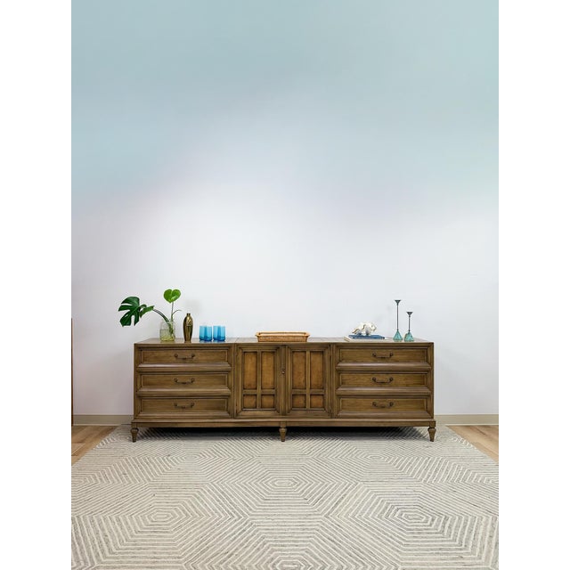 This impressive vintage mid-century modern three piece modular buffet and console server is a rare and substantial dining...