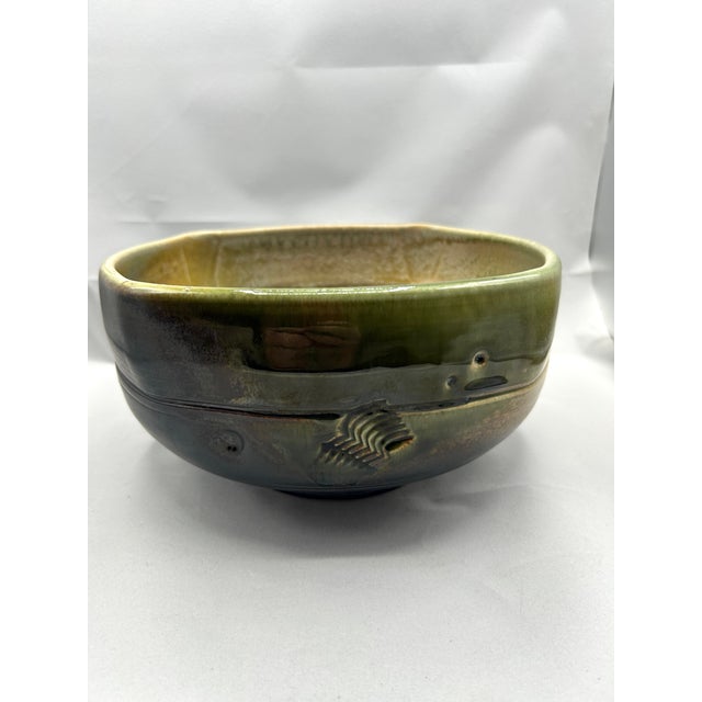This handcrafted bowl by renowned ceramic artist Craig Easter exemplifies his mastery of form, texture, and glaze....