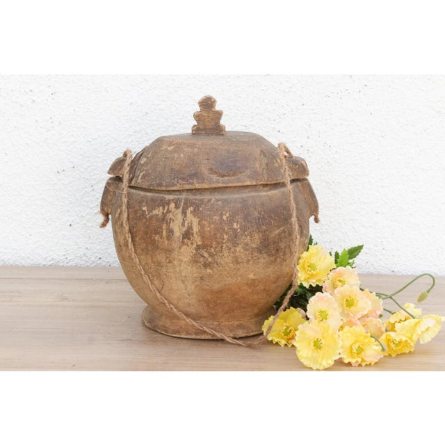 Discover the rustic charm and enduring craftsmanship of traditional artistry with this delightful wooden bowl with lid and...