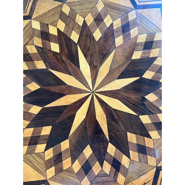 Sorrento round side table hand-made in Italy in the early 1800s using walnut. The table follows the canons of the style...