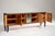 Italian Art Deco sideboard crafted from walnut and maple. It features four doors and a curved central section finished in...