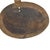A large spoon or scoop made out of wood carved with a large bowl and a long handle with metal designs. This spoon is from...