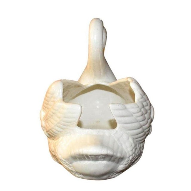 A petite ceramic swan planter. Signed at the bottom, "Mother 1969" Dimensions: 10" Wide 7" Deep 9" Tall