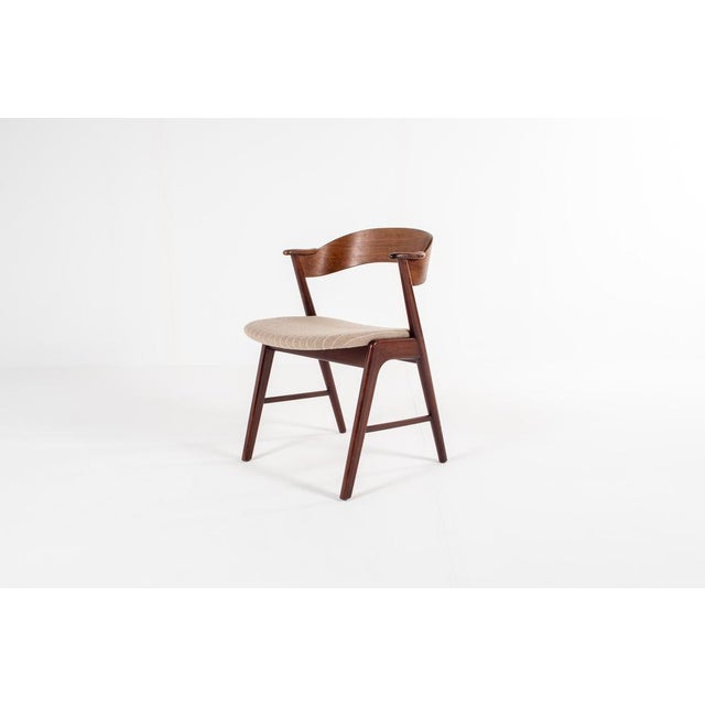 A stunning Danish Mid-Century Modern dining chair by Korup Stolefabrik, crafted from richly grained rosewood. The...
