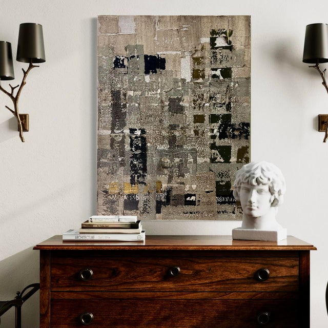 Archive by J. Kent Martin presents a richly textured field of layered neutrals—warm taupe, soft gray, and weathered...