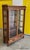 This is a very fine antique quartered oak sliding glass door bookcase cabinet made by Paine's Furniture Company,...