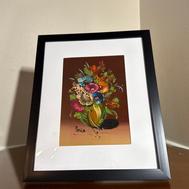 Beautiful vintage floral still life painting featuring a vibrant bouquet of multicolored flowers arranged in a decorative...